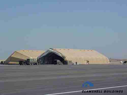 Two completed clamshell aircraft maintenance shelters