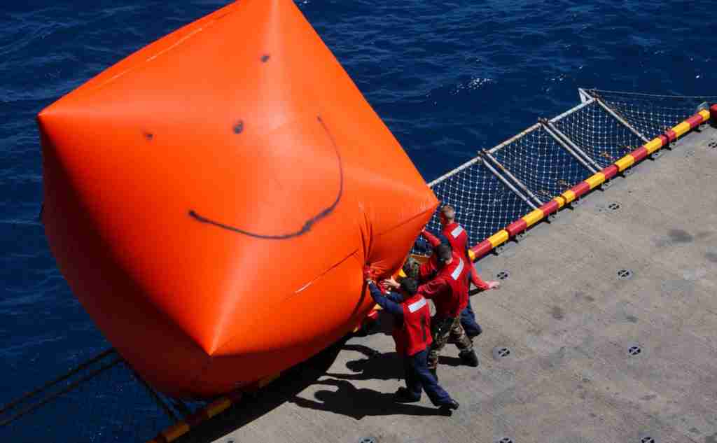 Sailors deploying floating target from USS Boxer